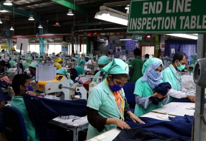 Garment employees work at Fakhruddin Textile Mills Limited in Gazipur, Bangladesh, on February 7, 2021. (Reuters)