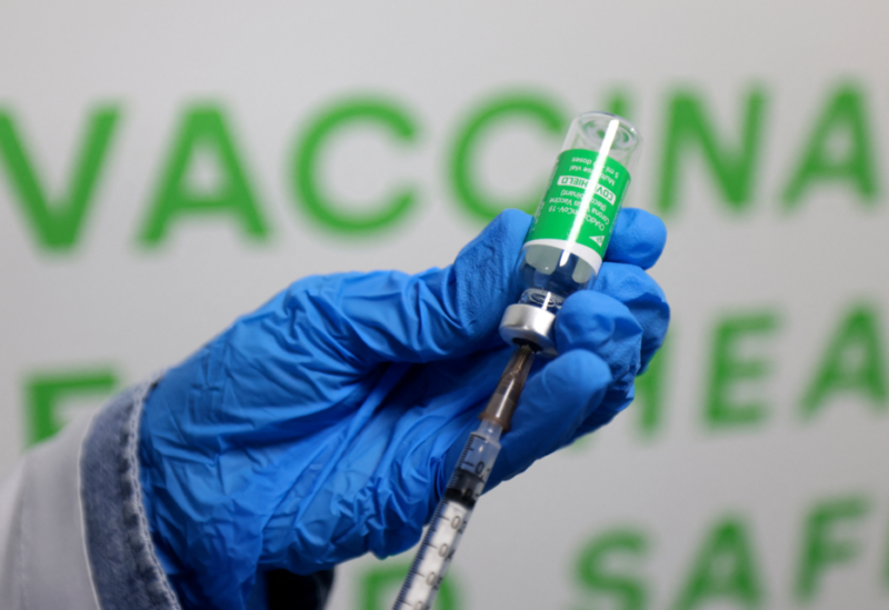 A health worker prepares an injection of the Oxford–AstraZeneca vaccine (Covishield) against the coronavirus at a vaccination centre set up at the Dubai International Financial Center in the Gulf emirate of Dubai, on February 3, 2021. (AFP)