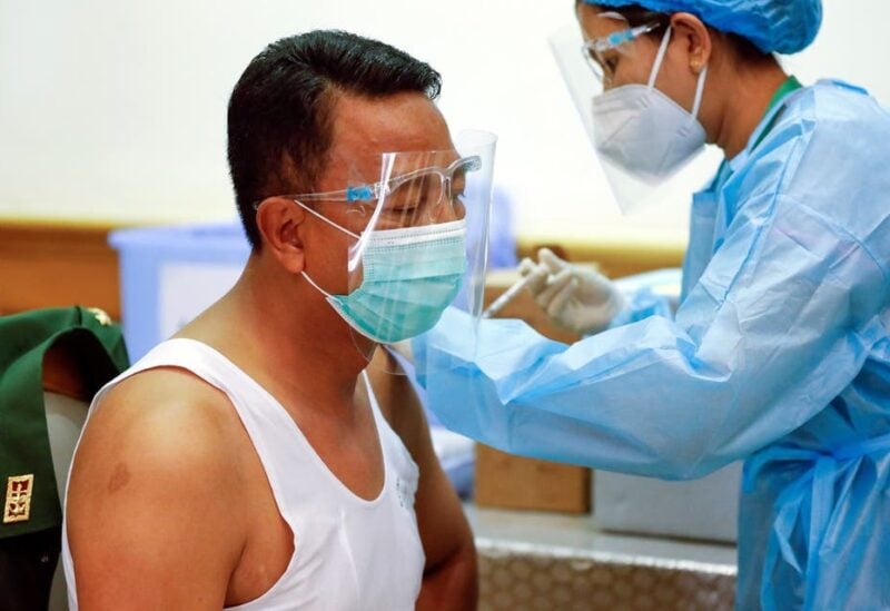 An army parliament member receives AstraZeneca's Covishield coronavirus disease (COVID-19) vaccine ahead of the opening of the new parliament in Naypyitaw, Myanmar, January 30, 2021. (Reuters)