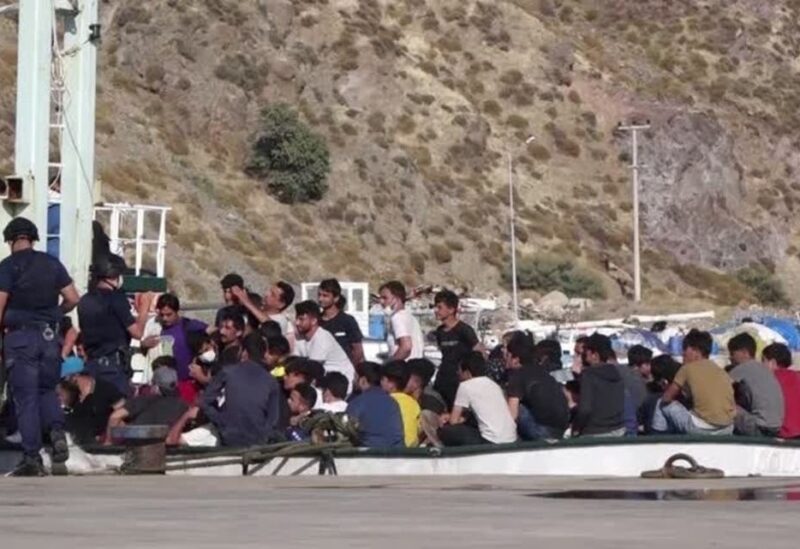 A screengrab shows a Turkish coastguard ferry and vessel carrying migrants arriving at port, Turkey, July 27, 2021. (Reuters)