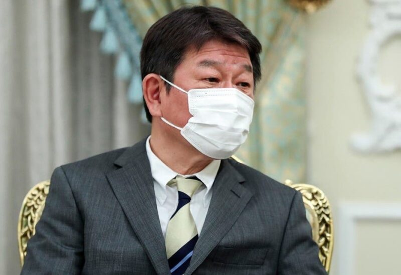 Japanese Foreign Minister Toshimitsu Motegi listens to Iranian President Ebrahim Raisi during their meeting at the presidency office, in Tehran, Iran, on Aug. 22, 2021. (AP)