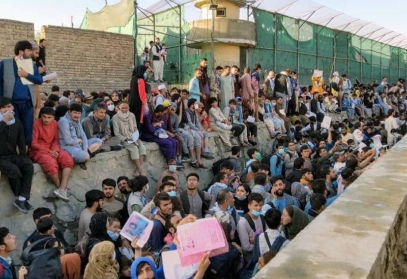 Crowds of people wait outside the airport in Kabul, Afghanistan August 25, 2021 in this picture obtained from social media. (Reuters)