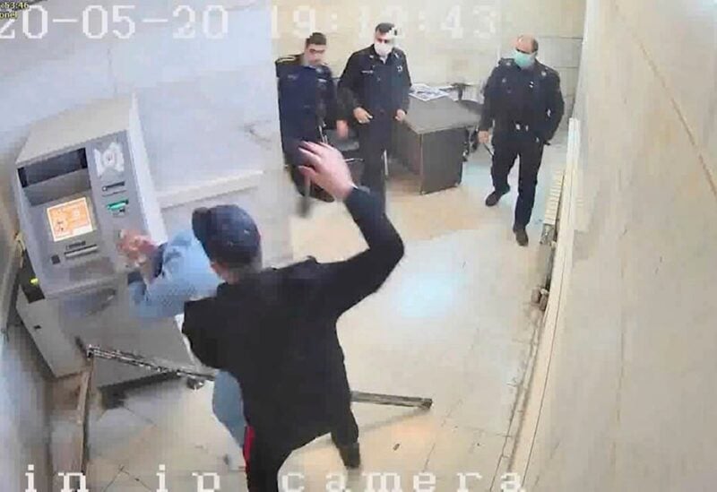 A guard beats a prisoner, at Evin prison in Tehran, Iran in this undated frame grab taken from video shared with The Associated Press by a self-identified hacker group called “The Justice of Ali.” (The Justice of Ali/AP)