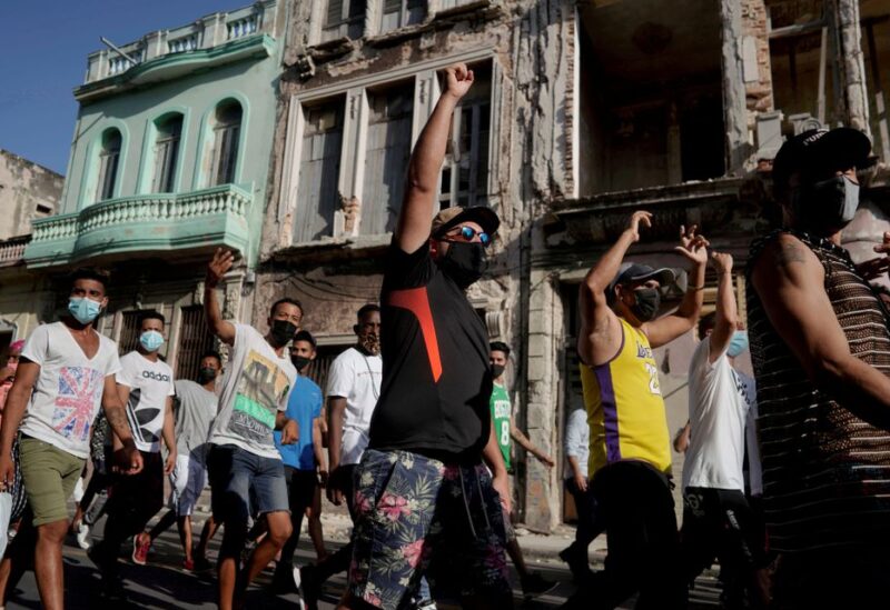 People shout slogans against the government during a protest against and in support of the government, amidst the coronavirus disease (COVID-19) outbreak, in Havana, Cuba July 11, 2021. REUTERS/Alexandre Meneghini