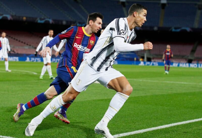 FC Barcelona's Lionel Messi in action with Juventus' Cristiano Ronaldo, Dec. 8, 2020. (Reuters)