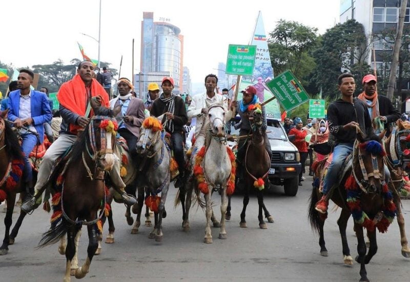 Thousands of Ethiopians from the capital and surrounding areas head to Meskel Square on August 8, 2021, to rally against the Tigray People’s Liberation Front (TPLF) under the motto “I march to Save Ethiopia” and renew commitments to support the national army. (AP)