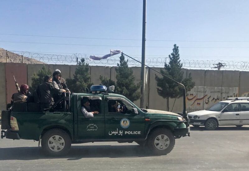 Taliban fighters ride on a police vehicle in Kabul, Afghanistan, August 16, 2021. (File photo: Reuters)