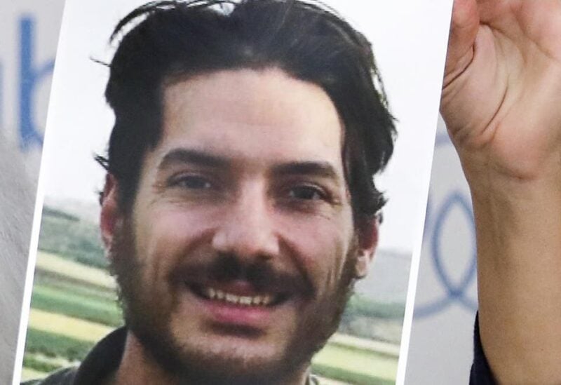 A file photo shows Debra Tice (unseen), mother of US journalist Austin Tice who was kidnapped in Syria five years prior, holds a dated portrait of him during a press conference in the Lebanese capital Beirut on July 20, 2017. (Joseph Eid/AFP)