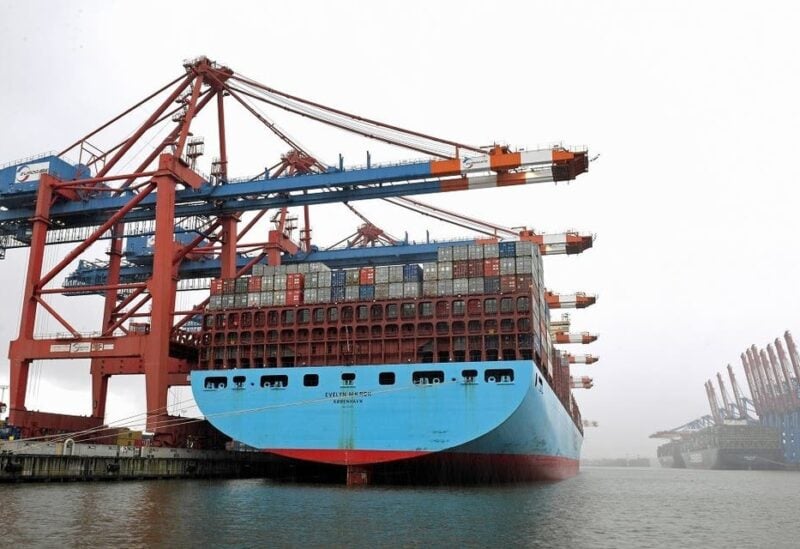 Container ship ‘Evelyn Maersk’ is loaded during snowfall at a container terminal in a harbor amid the coronavirus pandemic, in Hamburg, Germany, on April 6, 2021. (Reuters)