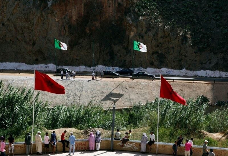 People stand near a border post on the Algerian side of the Morocco-Algeria border in the north east of Morocco. (File photo: Reuters)