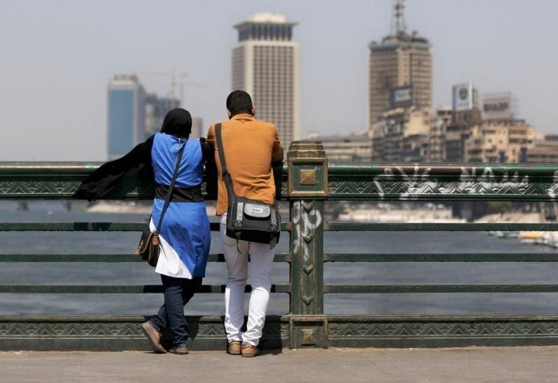 A couple of Egyptians share a moment as they overlook the Nile river from a bridge in Cairo, Egypt, Monday, Sept. 9, 2013. (File photo: AP)