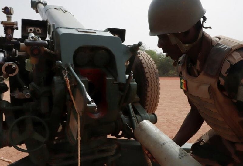 A Malian soldier of the 614th Artillery Battery is pictured during a training session on a D-30 howitzer with the European Union Training Mission (EUTM), to fight militants, in the camp of Sevare, Mopti region, in Mali, on March 23, 2021. (Reuters)