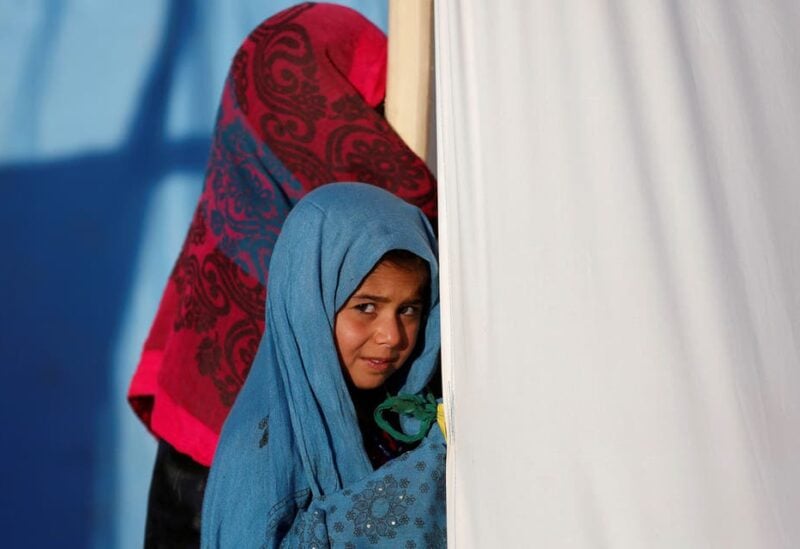 An internally displaced Afghan girl stands outside her tent at a refugee camp in Herat province, Afghanistan October 14, 2018. (File photo: Reuters)