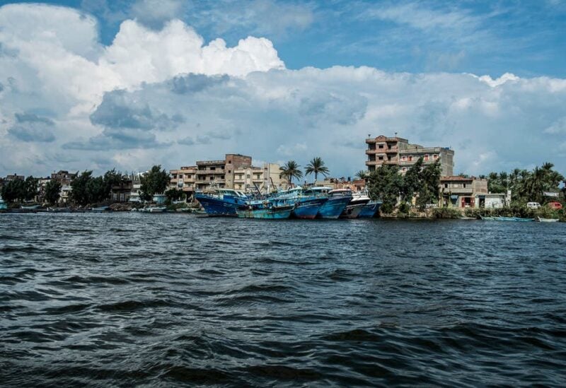 This picture taken on October 24, 2019 shows a view of boats moored by the town of Borg Megheizel, lying on the Rosetta branch of the Nile river delta in Egypt's northern Kafr el-Sheikh Governorate, some 55 kilometers northeast of Alexandria. (AFP)