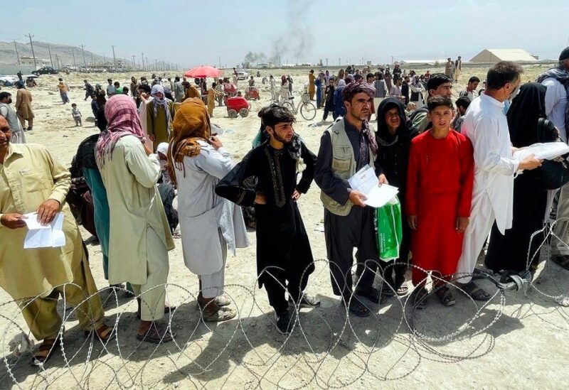 Hundreds of people gather outside the international airport in Kabul, Afghanistan, on August 17, 2021. (AP)