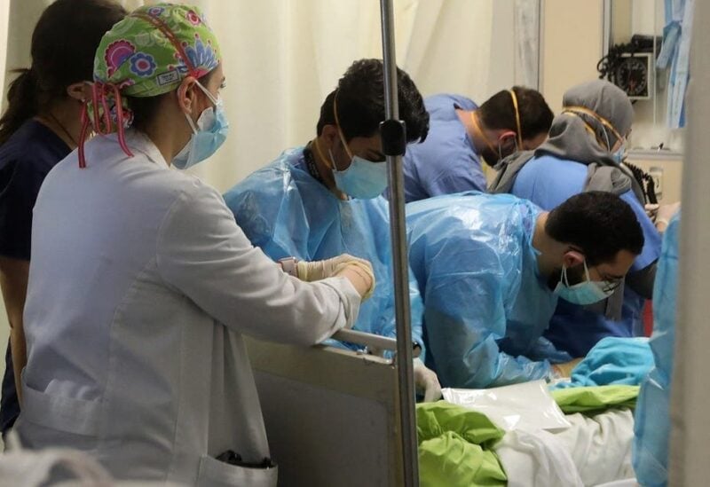 US-trained emergency doctor Nour al-Jalbout (L) is pictured during her shift in the emergency department of the AUBMC (American University of Beirut Medical Centre) in the Lebanese capital Beirut on March 17, 2021. (AFP)