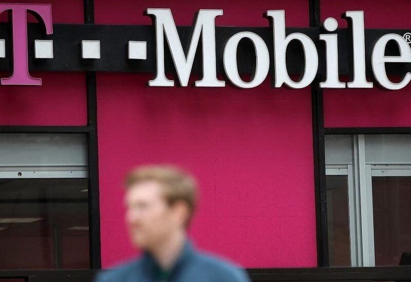A pedestrian walks by a T-Mobile store in San Francisco, California. (AFP)
