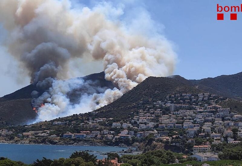 A handout picture released by Catalonia's firefighting squad (Bombers Generalitat Catalunya) shows smoke billowing from a fire raging near El Port de la Selva and Llanca close to the Cap de Creus Natural Park on July 16, 2021.(File photo: AFP)