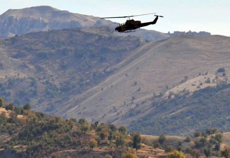A file photo shows a Turkish military helicopter flies over a mountain in Yemisli, Hakkari province near the Iraqi border in southeastern Turkey. (AFP/Mustafa Ozer)