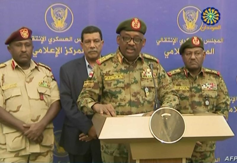 A grab from a broadcast on Sudan TV on July 11, 2019 shows General Jamal Omar (C), a member of Sudan's Transitional Military Council (TMC), delivering a speech in Khartoum. - Sudan's ruling military council foiled a coup attempt, the top general announced on state television late on July 11, 2019, saying that 12 officers and four soldiers had been arrested. The announcement came as the ruling military and civilian protesters agreed last week to end a political impasse after the army in April ousted longtime ruler Omar al-Bashir on the back of a popular uprising. (Photo by - / Sudan TV / AFP)