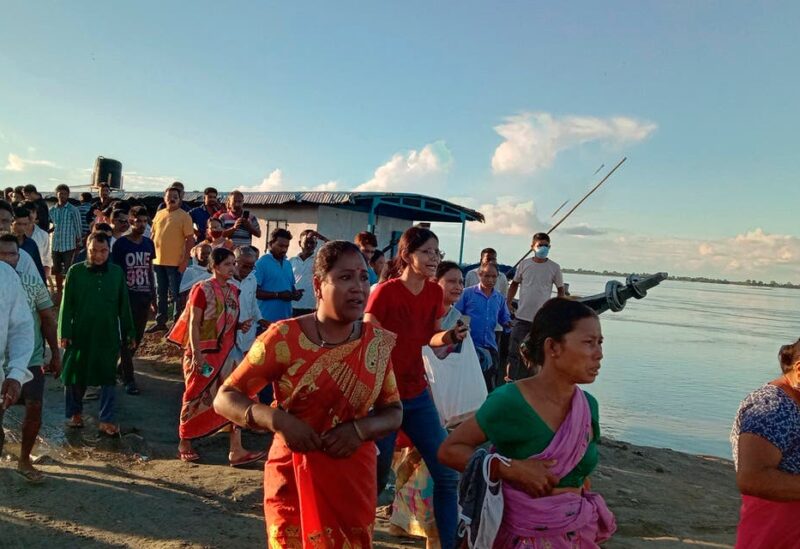People gather at the site of a ferry capsize in the Brahmaputra river, near Nimati Ghat, in Jorhat, about 350 kilometers (220 miles) from Gauhati, the capital of the northeastern Indian state of Assam, Wednesday, Sept. 8, 2021. One person died and several are feared missing after two passenger ferries collided, an official said. The head-on collision caused one of the boats to sink, said Ashok Barman, deputy commissioner of Jorhat city. (File photo: AP)