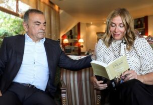 Carole Ghosn, wife of former car executive Carlos Ghosn, holds their latest book ‘Ensemble toujours’ during an interview with Reuters in Beirut, Lebanon, on June 14, 2021. (Reuters)