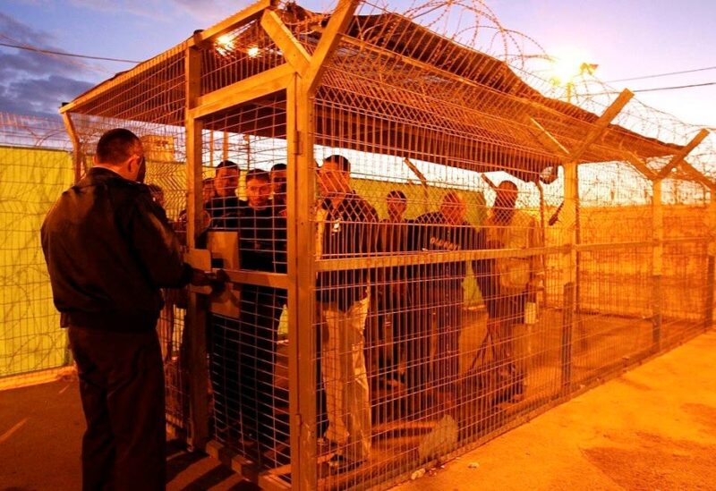 Palestinian prisoners wait to be released from Ketziot prison in southern Israel December 3, 2007. (Reuters)