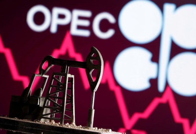 A 3D printed oil pump jack is seen in front of displayed stock graph and Opec logo in this illustration picture. (Reuters)