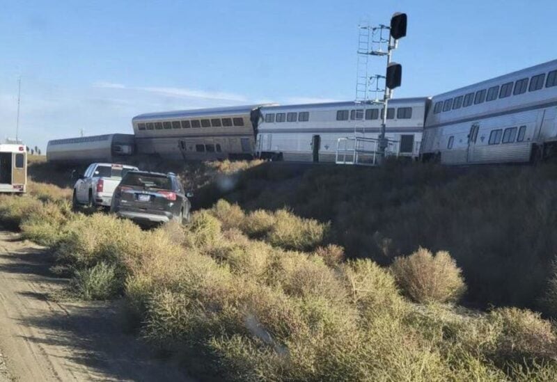 In this photo provided by Kimberly Fossen an ambulance is parked at the scene of an Amtrak train derailment on Saturday, Sept. 25, 2021, in north-central Montana. Multiple people were injured when the train that runs between Seattle and Chicago derailed Saturday, the train agency said. (AP)