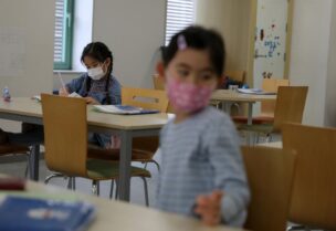 Children, wearing protective face masks, following an outbreak of coronavirus, are seen at Stella Kids, daycare center in Tokyo, Japan, March 5, 2020. (File photo: Reuters)