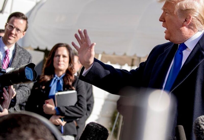 White House deputy press secretary Judd Deere, left, and White House press secretary Stephanie Grisham, second from left, listens as President Donald Trump speaks, Nov. 8, 2019. (AP)