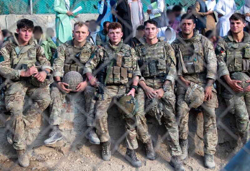 Members of the UK Armed Forces rest during the evacuation of entitled personnel from Kabul airport, in Kabul, Afghanistan, on August 19-22, 2021, in this handout picture obtained by Reuters on August 23, 2021. (Reuters)