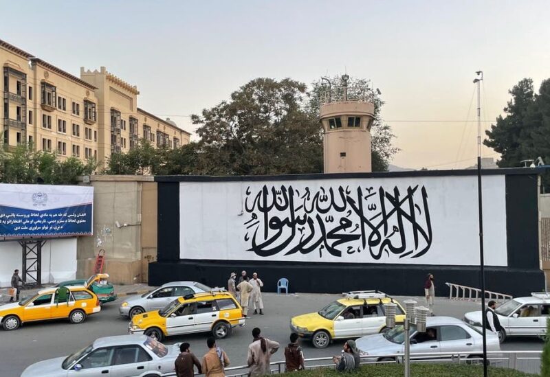 A giant Taliban flag painted over the entrance of the former US Embassy building in Afghanistan’s capital Kabul. (Twitter)