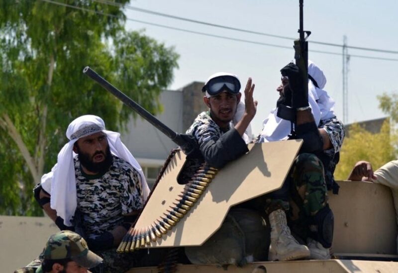 Taliban fighters atop a Humvee vehicle parade along a road to celebrate after the US pulled all its troops out of Afghanistan, in Kandahar on September 1, 2021 following the Taliban’s military takeover of the country. (AFP)