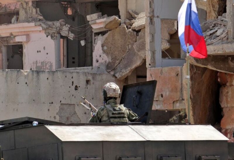 A picture shows Russian troops in the Syrian district of Daraa al-Balad in Syria's southern province of Daraa