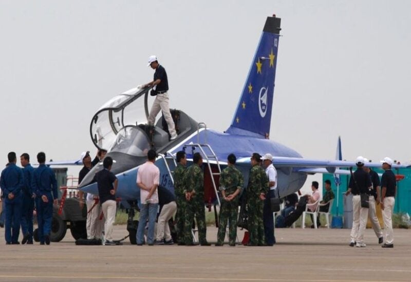 Aircraft personnel work on an L-15 Falcon advanced jet trainer before the opening of the 7th China International Aviation & Aerospace Exhibition