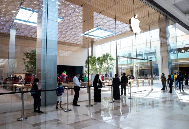 Customers queue outside the redesigned Apple Store at Yas Mall in Abu Dhabi
