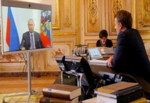 File photo of French President Emmanuel Macron talking with Russian President Vladimir Putin during a video conference at the Elysee Palace in Paris, France, on June 26, 2020