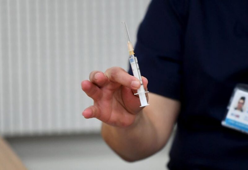 Medics receive the Pfizer-BioNTech coronavirus vaccines at the Helsinki University Hospital in Helsinki,