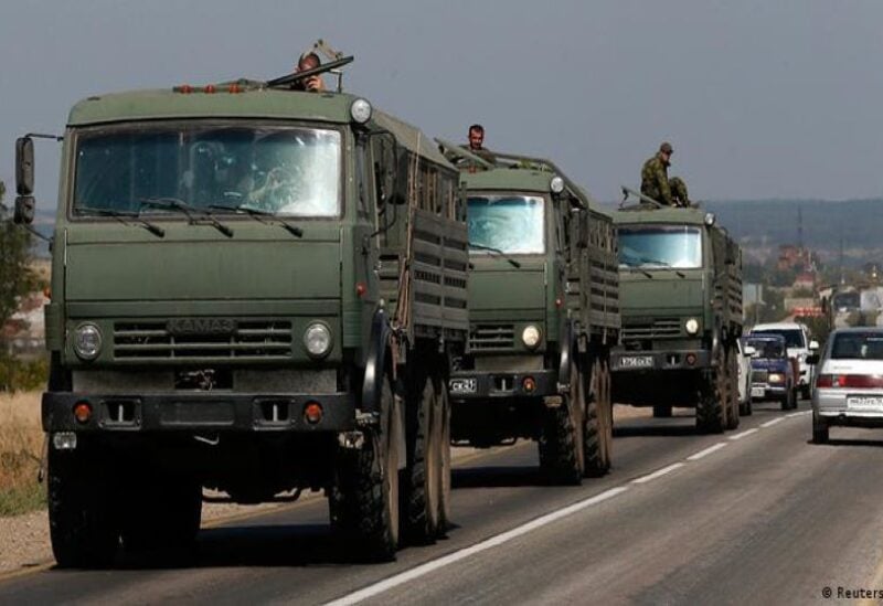 Military truck drives along a highway east of Kyiv, Ukraine