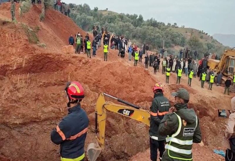 People use machinery to excavate the ground in order to free the five-year-old trapped in an underground well, in Chefchaouen, Morocco