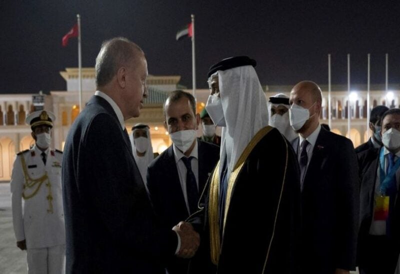 Turkish President Recep Erdogan (left) shakes hands with UAE Deputy Prime Minister Sheikh Mansour bin Zayed Al Nahyan