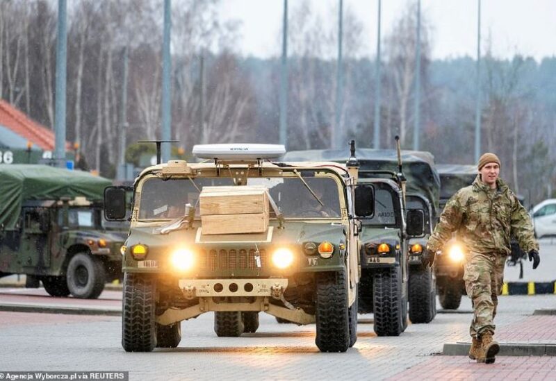 US soldiers from the 82nd Airborne Division walk near the G2A Arena following their arrival at Rzeszow-Jasionka Airport, in Jasionka, Poland