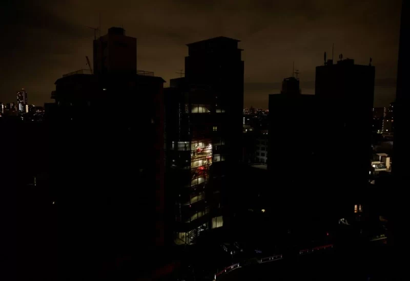 Houses and buildings are seen in an electric stoppage at the area after an earthquake at Toshima ward in Tokyo, Japan March 17, 2022.