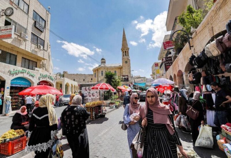Palestinians shop at a market in the old city of Bethlehem in the occupied West Bank