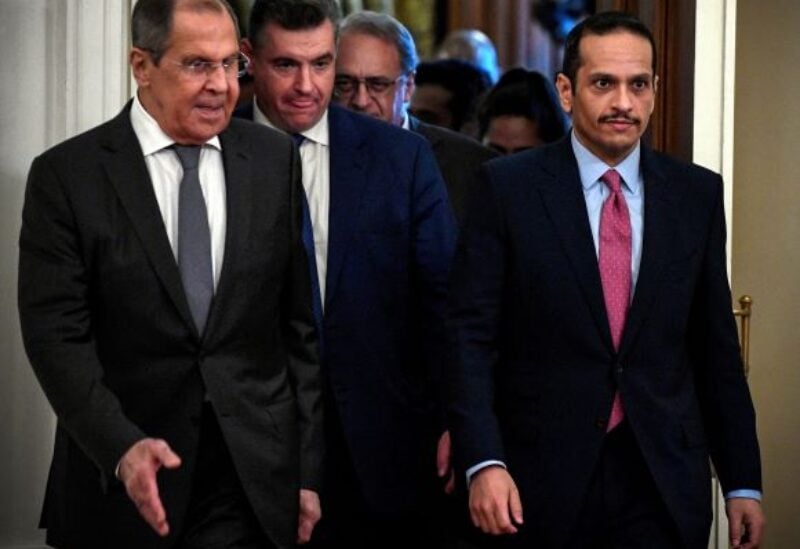 Russian Foreign Minister Sergei Lavrov walks with Qatari Foreign Minister Sheikh Mohammed bin Abdulrahman Al-Thani in Moscow, Russia September 11, 2021.
