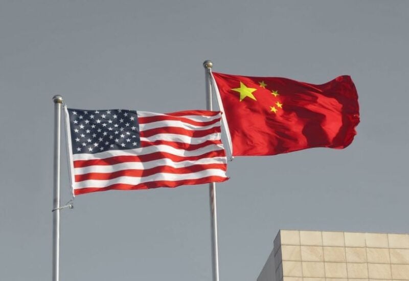 China's and the US flags are seen