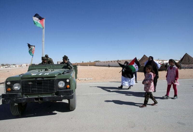 People greet Sahrawi soldiers during the visit of U.N. envoy to Western Sahara