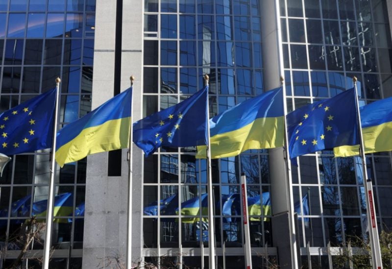 Flags of European Union and Ukraine flutter outside EU Parliament building