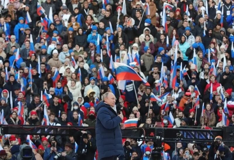 Russian President Vladimir Putin attends a rally marking the eighth anniversary of Russia’s annexation of Crimea at the Luzhniki stadium in Moscow on March 18, 2022